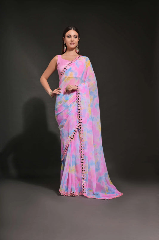 A woman modeling a pastel pink and blue tie-dye georgette saree with mirror lace border Glanzavi