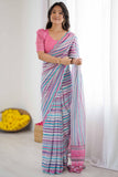 Woman wearing a colorful saree with a pink blouse against a white background Glanzavi