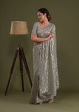 Gray Pleated Georgette Saree with Subtle Golden Zigzag Pattern Minimalist Partywear Saree
