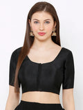 Woman wearing a black blouse with a plain background Glanzavi