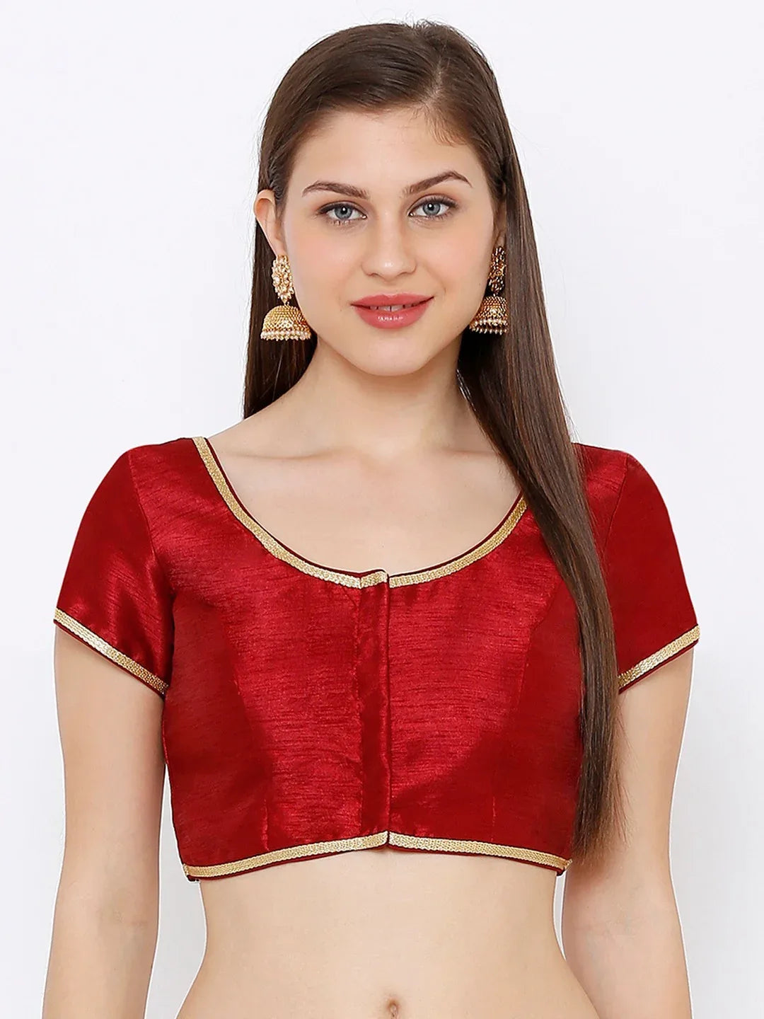 Woman wearing a red blouse with gold trim on a white background Glanzavi