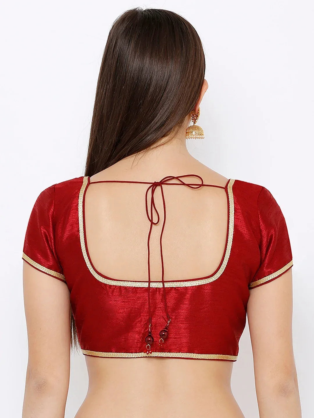 Red blouse with open back design on a white background Glanzavi