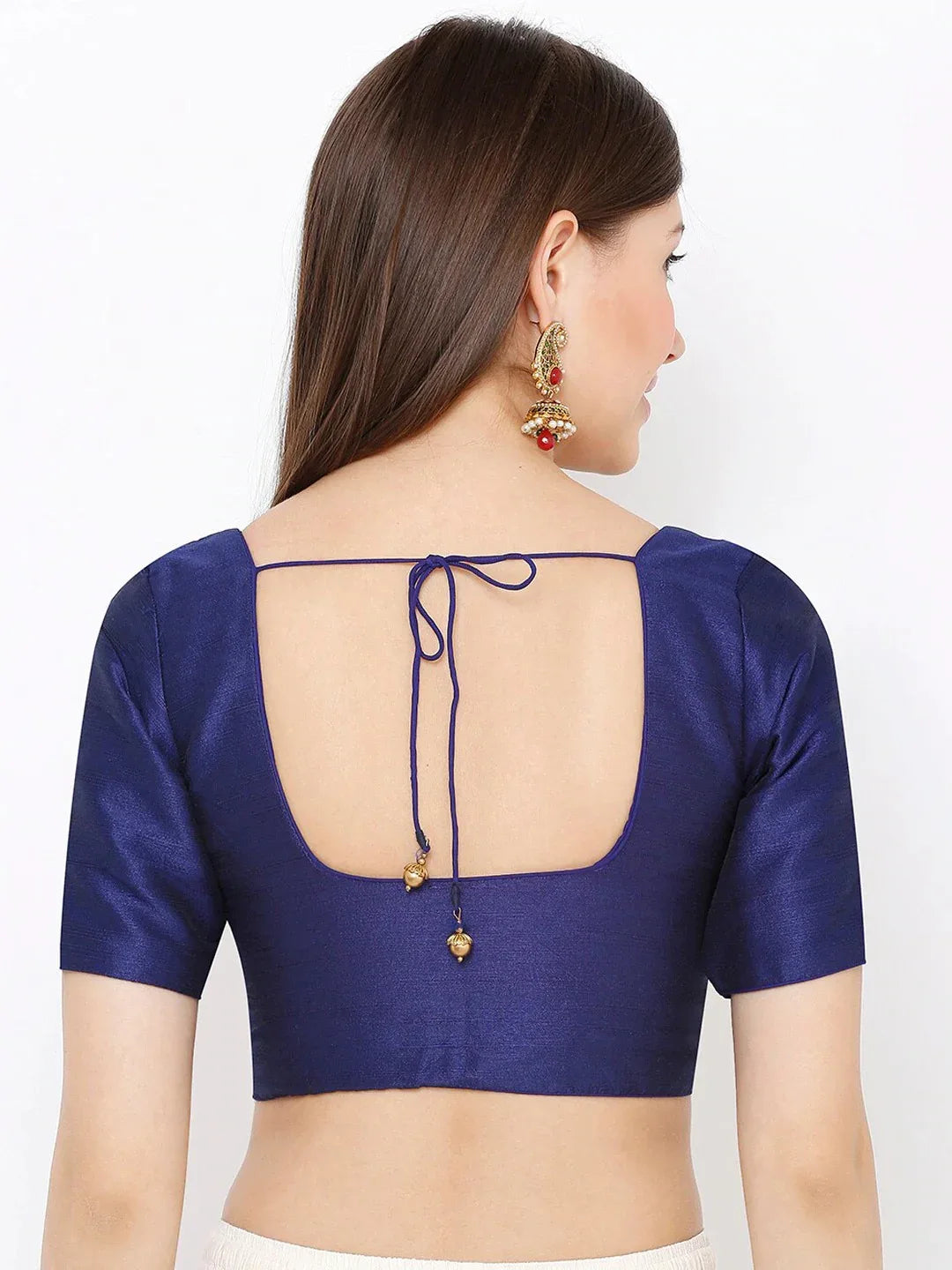 Woman wearing a blue blouse with a unique back design on a white background Glanzavi