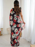 Woman holding a floral-patterned scarf in a room with white curtains Glanzavi.
