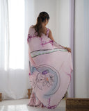 Woman wearing a pink floral dress with a white curtain background Glanzavi