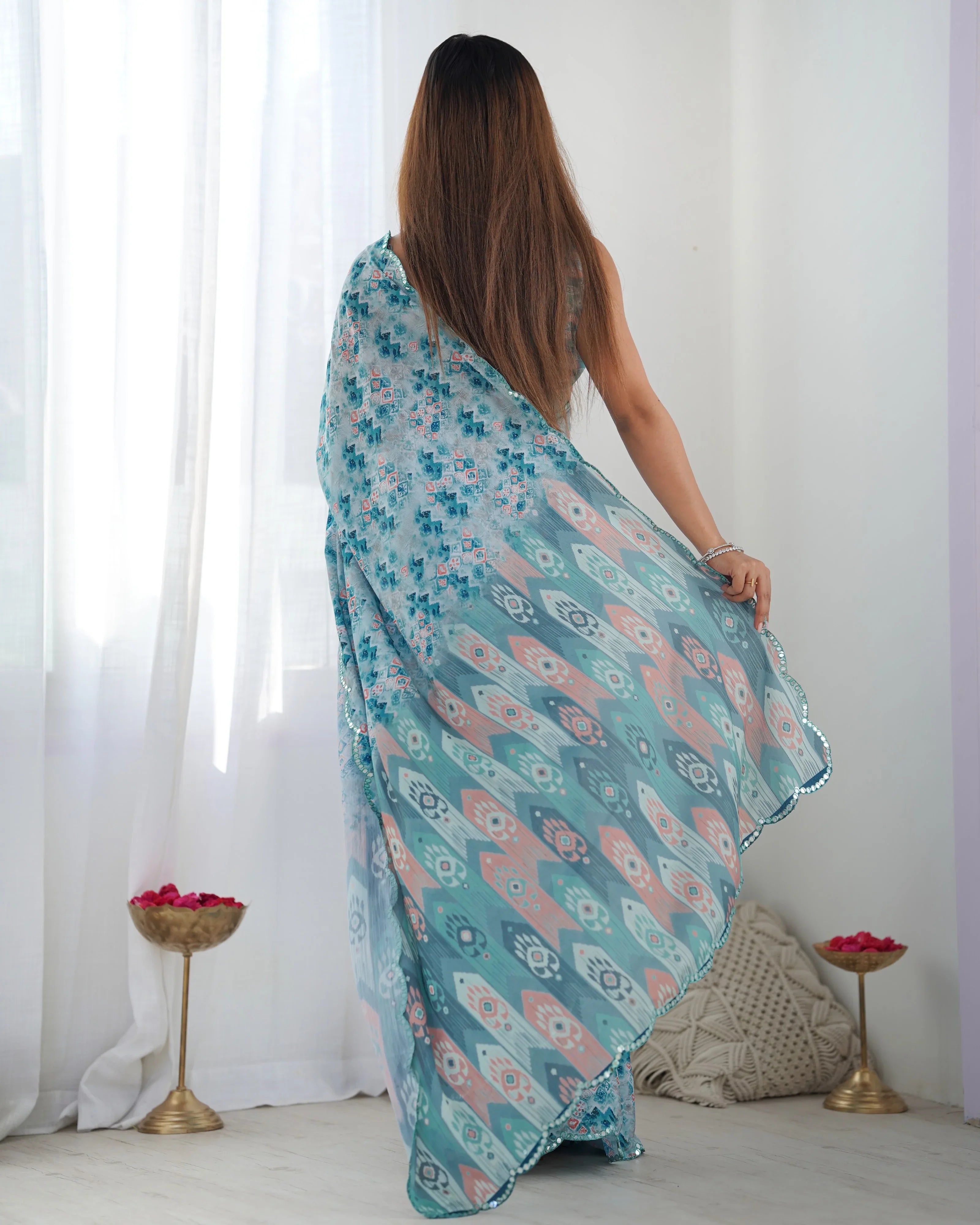 Woman wearing a floral patterned scarf in a minimalistic room Glanzavi