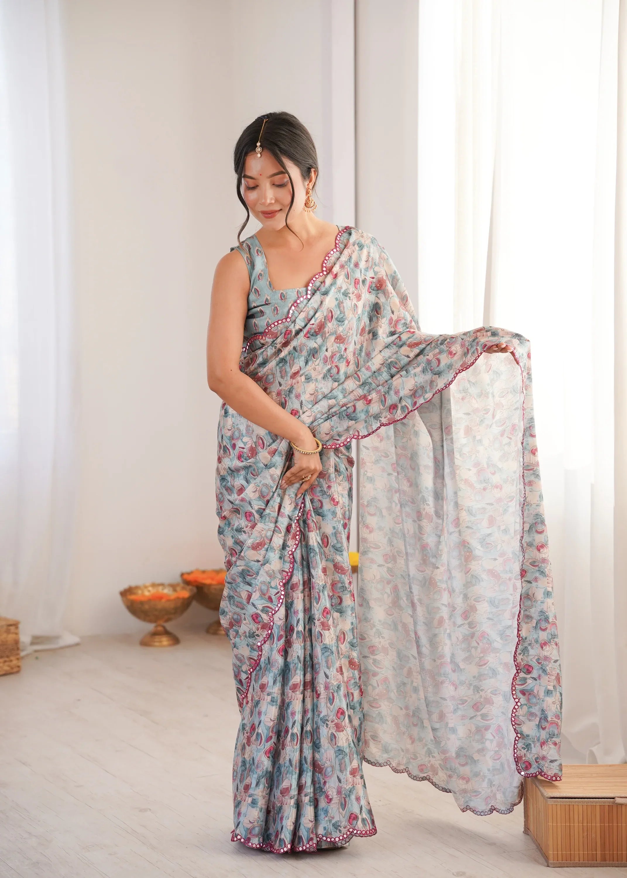 Woman wearing a floral saree in a minimalistic room Glanzavi.