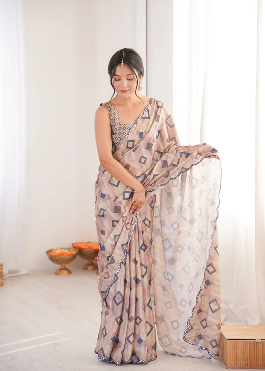 Woman wearing a patterned saree in a minimal indoor setting Glanzavi