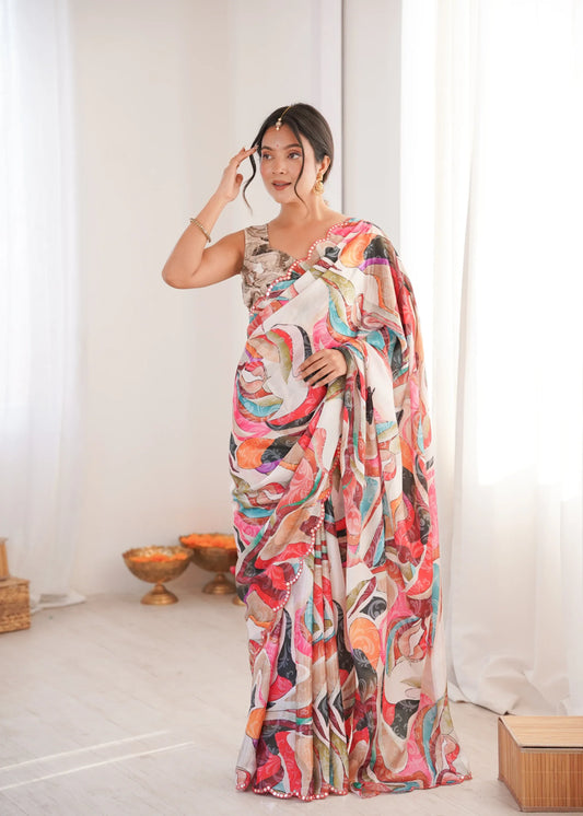 Woman wearing a colorful saree in a minimal indoor setting Glanzavi