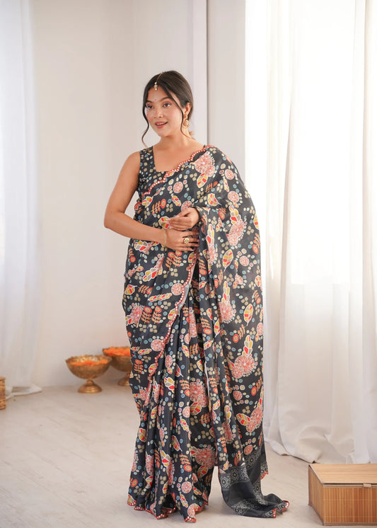 Woman wearing a floral saree in a minimal indoor setting Glanzavi