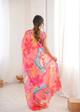 Woman wearing a colorful floral dress in a minimal indoor setting Glanzavi