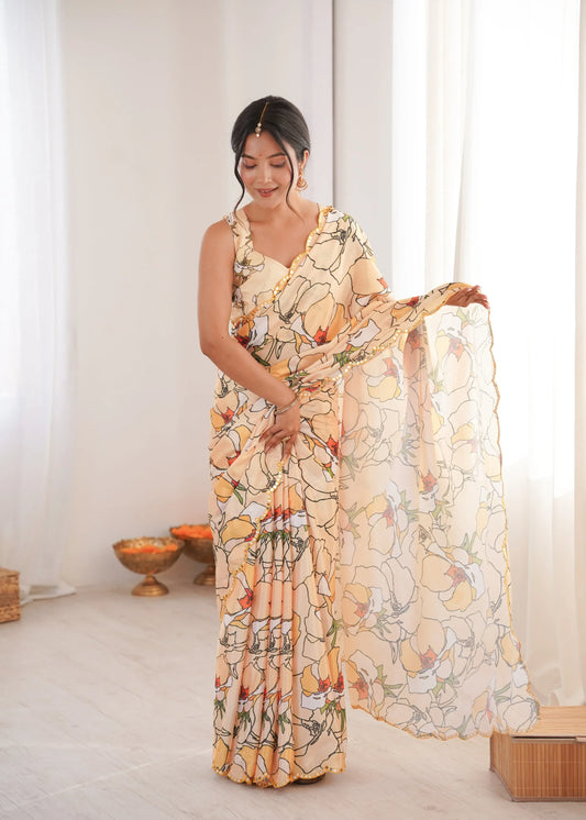 Woman wearing a floral dress with a sheer overlay in a bright room Glanzavi.