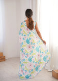 Woman wearing a floral dress in a minimal indoor setting Glanzavi