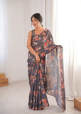 Woman wearing a floral saree in a minimalistic setting Glanzavi