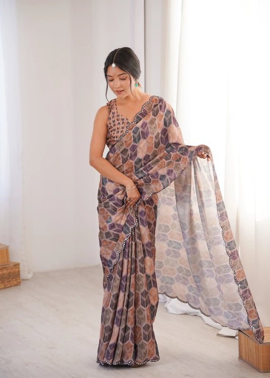 Woman wearing a patterned saree in a minimal indoor setting Glanzavi