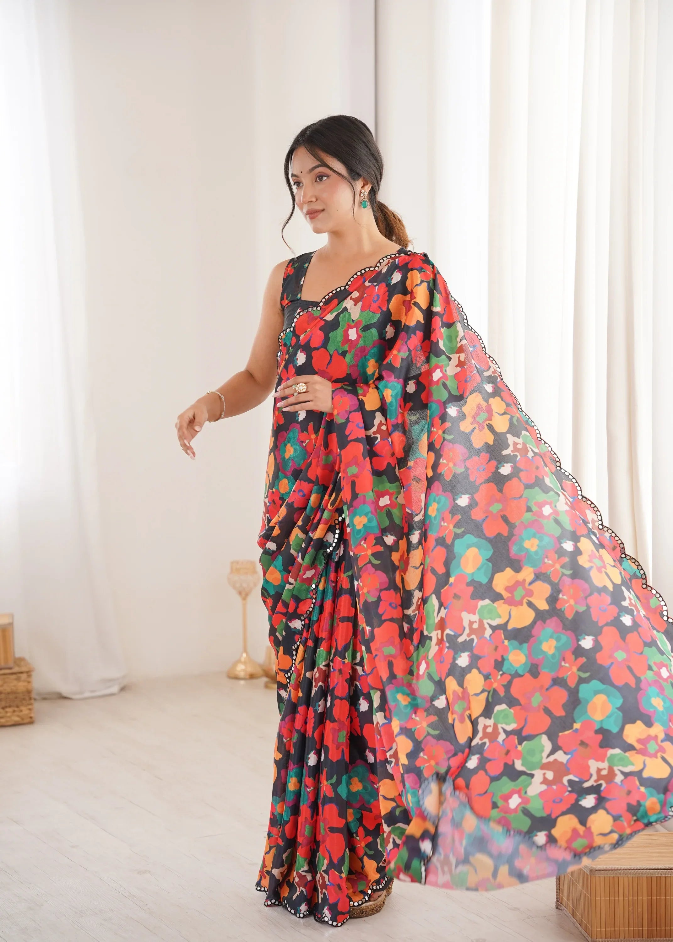 Woman wearing a colorful floral saree in a bright room-glanavi