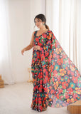 Woman wearing a colorful floral saree in a bright room-glanavi
