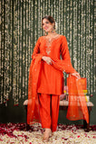 Woman in an orange traditional outfit with a decorative background Glanzavi