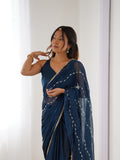 Elegant Teal Blue Embellished Georgette Saree with Golden Trim
