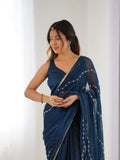Elegant Teal Blue Embellished Georgette Saree with Golden Trim