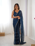 Elegant Teal Blue Embellished Georgette Saree with Golden Trim