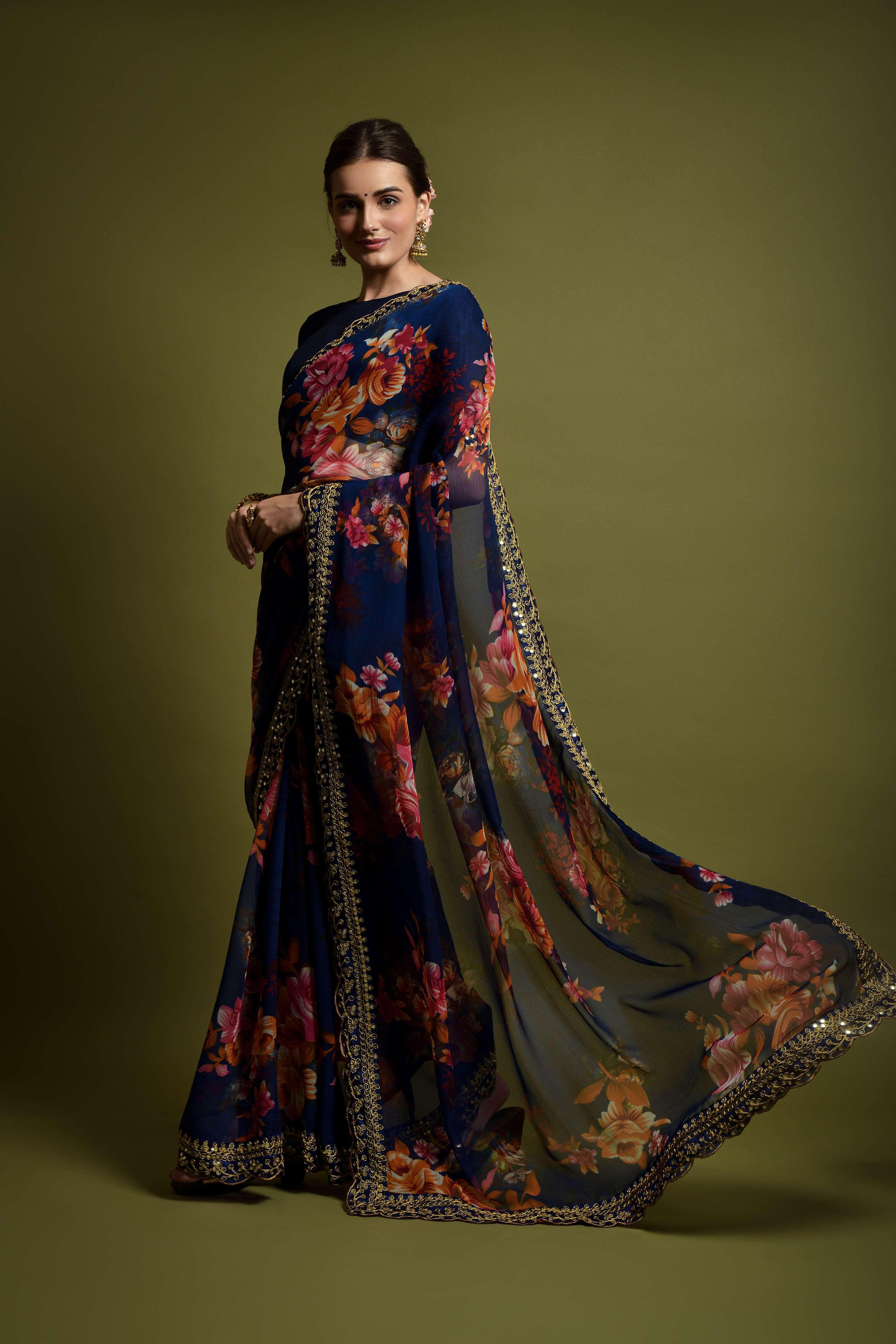 Woman wearing a floral dress with a long shawl against a green background Glanzavi
