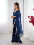 Flora Teal Blue Floral Embellished Net Saree with Gold Border