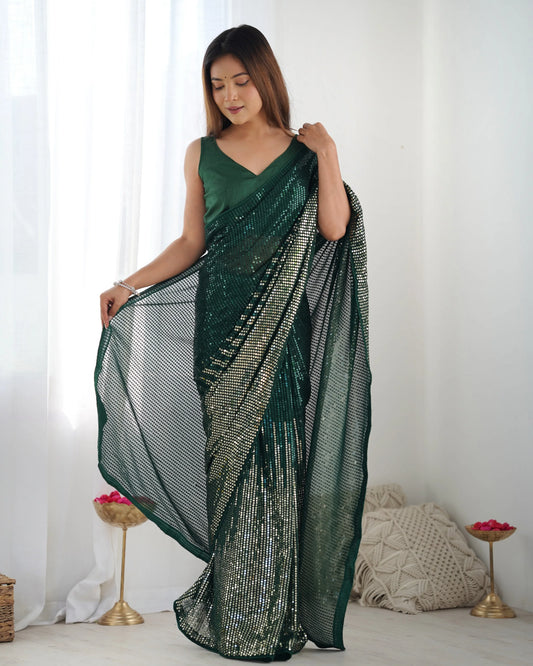 Woman wearing a green saree with a white background Glanzavi