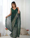 Woman wearing a green saree with a white background Glanzavi