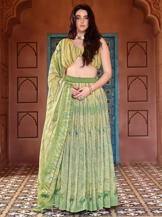 Woman wearing a green saree with a traditional architectural background Glanzavi