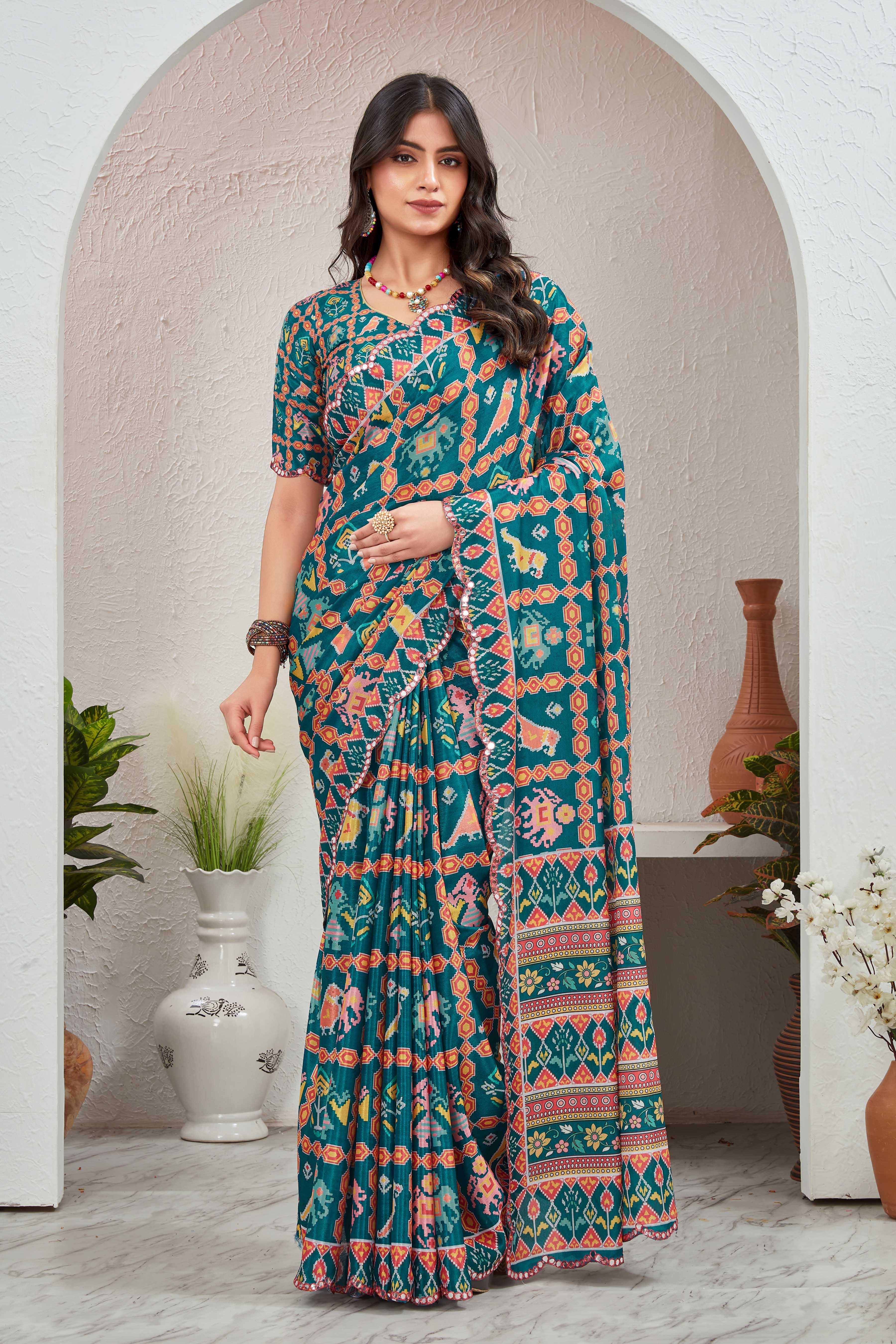 Woman wearing a colorful saree in an indoor setting with decorative elements Glanzavi