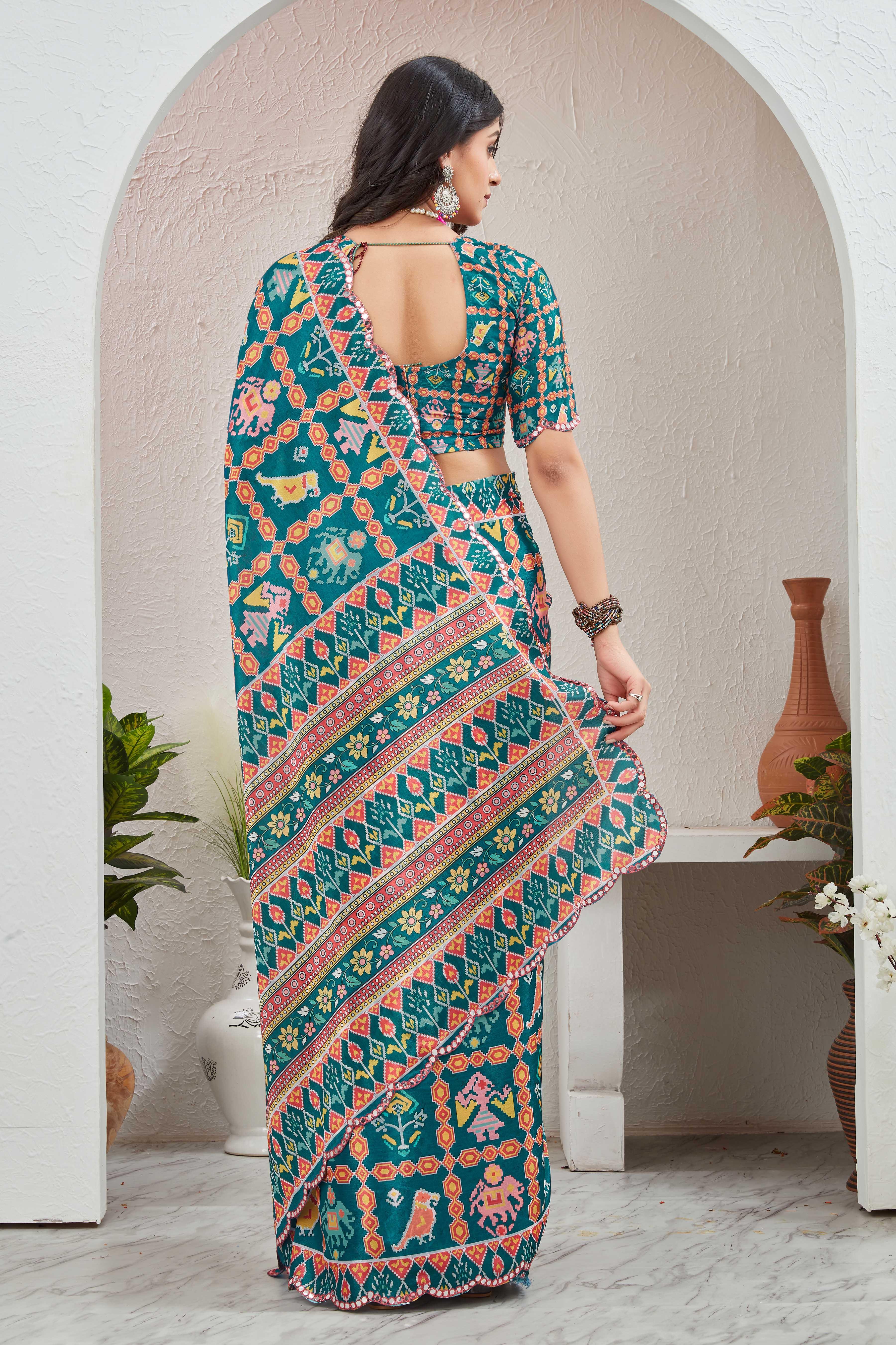 Woman wearing a colorful saree with a pattern in a minimalistic setting Glanzavi