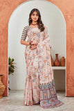 Woman wearing a floral saree standing in front of an archway with decorative vases Glanzavi