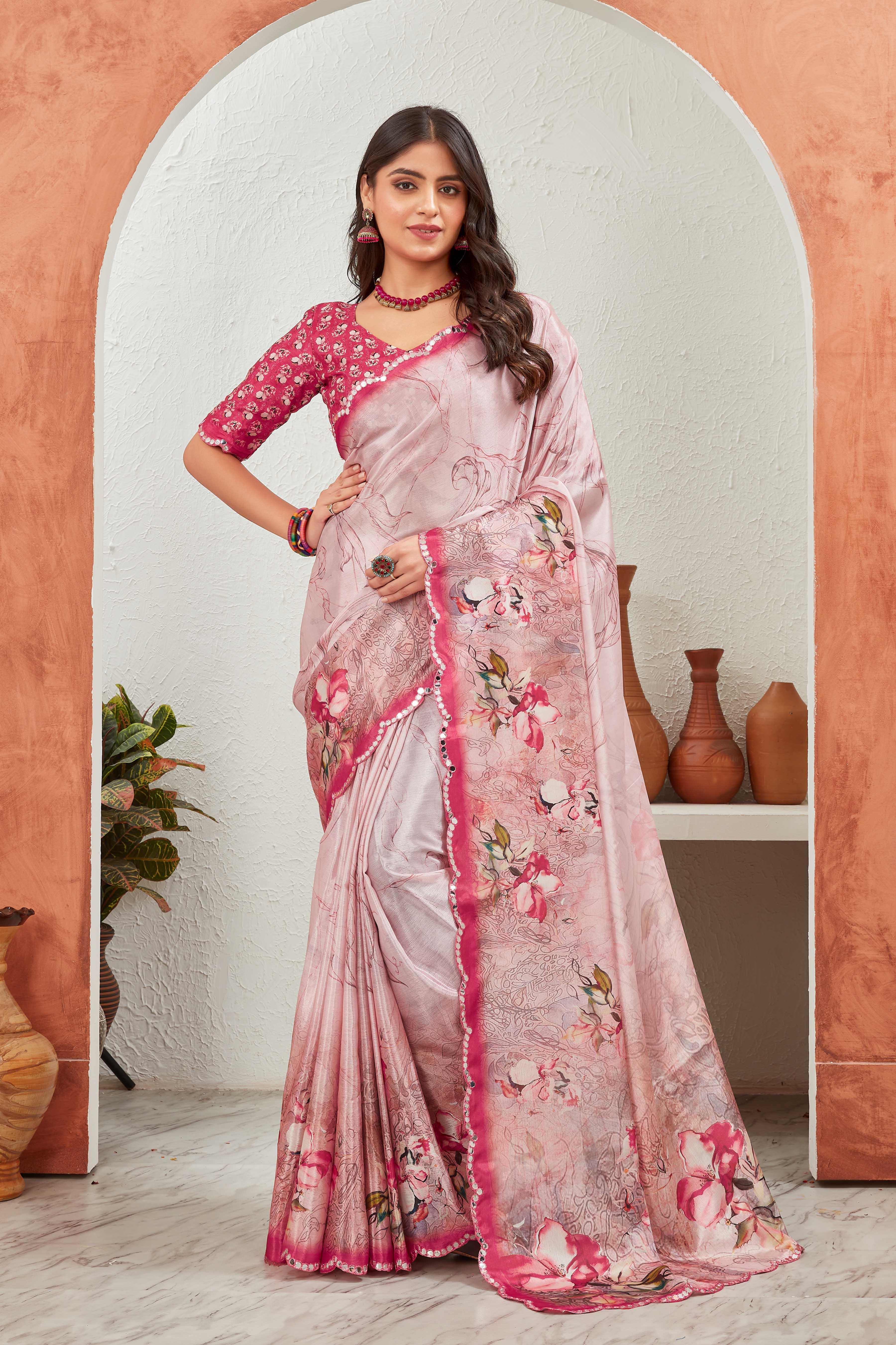 Woman wearing a pink and white saree with floral patterns in an indoor setting Glanzavi