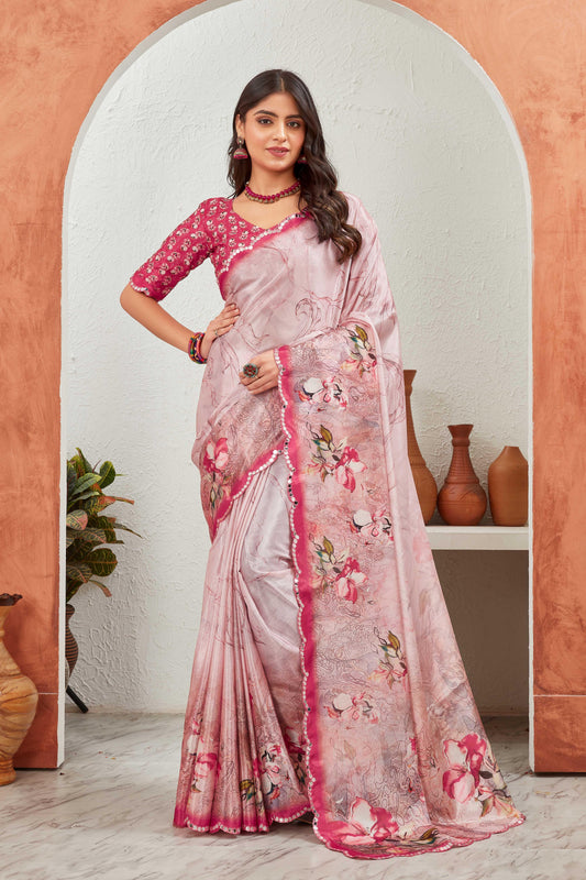Woman wearing a pink and white saree with floral patterns in an indoor setting Glanzavi