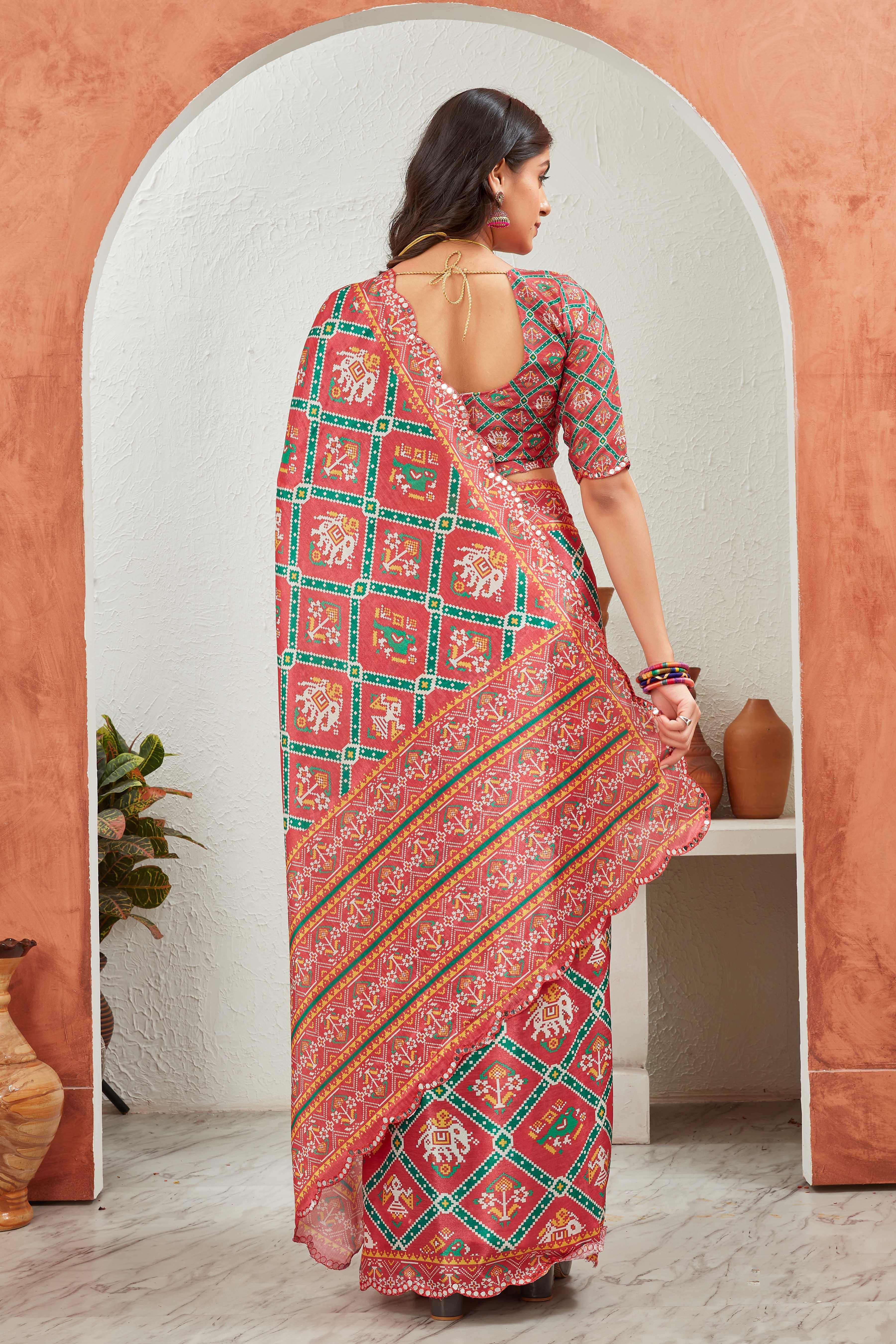 Woman wearing a traditional saree with a geometric pattern in a decorative setting Glanzavi