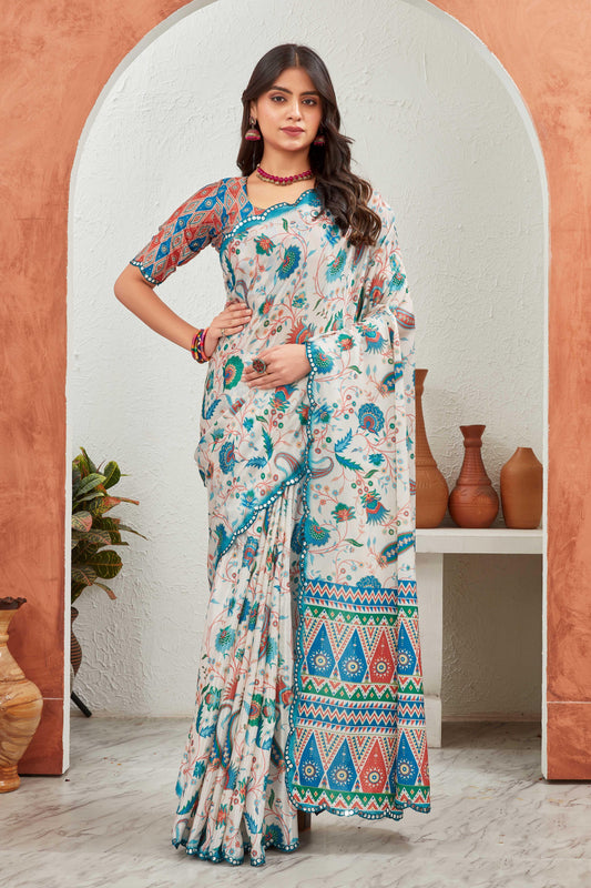 Woman wearing a colorful saree standing in front of an archway with decorative vases Glanzavi.