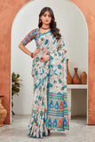 Woman wearing a colorful saree standing in front of an archway with decorative vases Glanzavi.