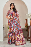 Woman wearing a colorful floral saree indoors with a neutral background Glanzavi