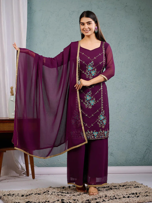 Woman in a purple traditional outfit with embroidered details Glanzavi