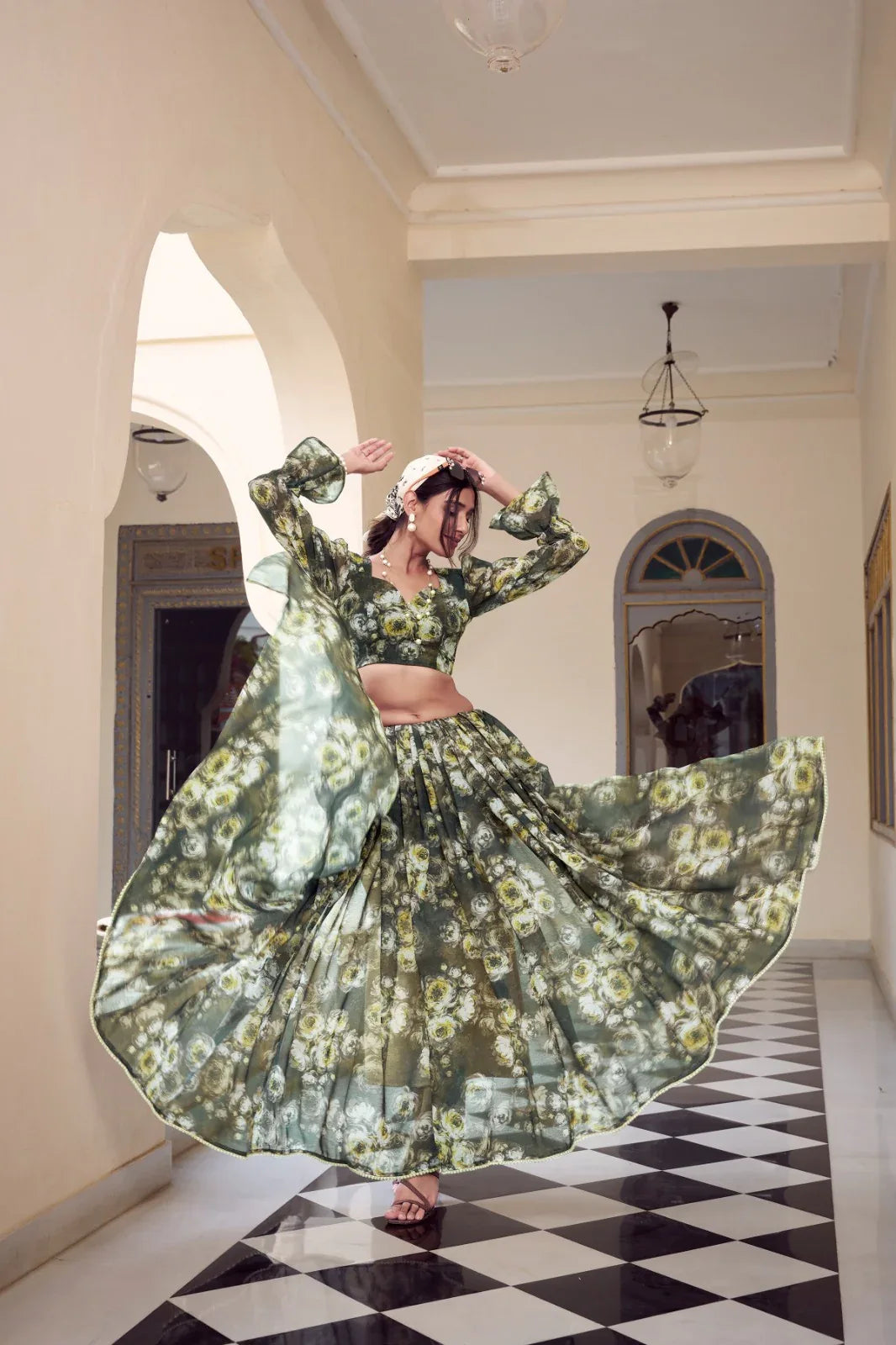 Woman in a floral dress dancing in a hallway with checkered floor Glanzavi