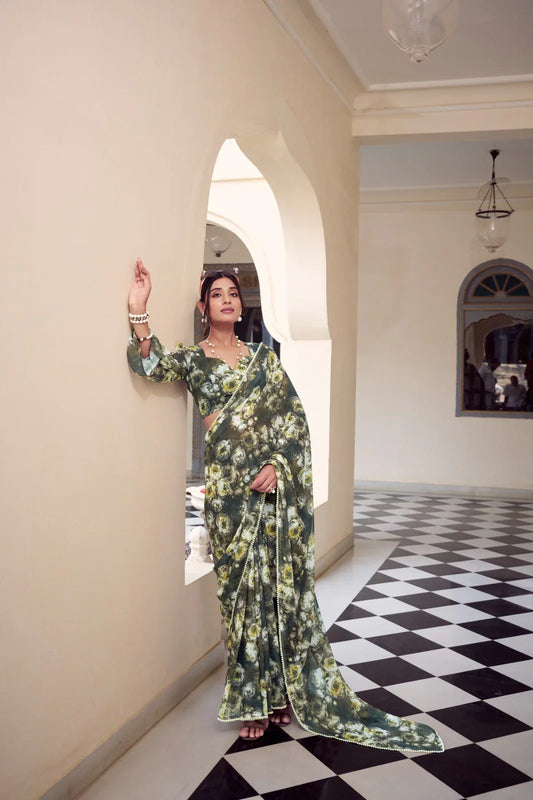Woman in a floral dress standing in a room with checkered floor and archway Glanzavi.