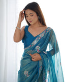 Petrol Blue Organza Saree with Floral Embroidered Border – Premium Ethnic Wear