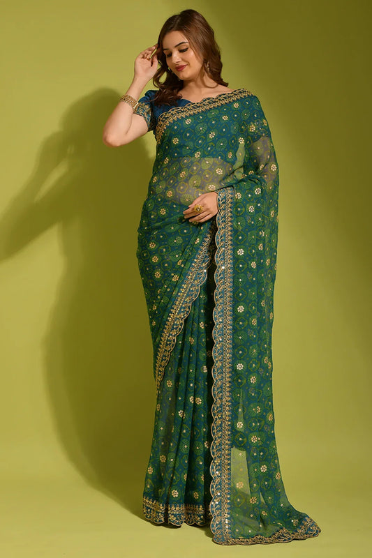 Woman wearing a green saree with gold patterns against a green background Glanzavi