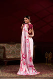 Woman in a white saree with pink floral patterns in an elegant room Glanzavi.