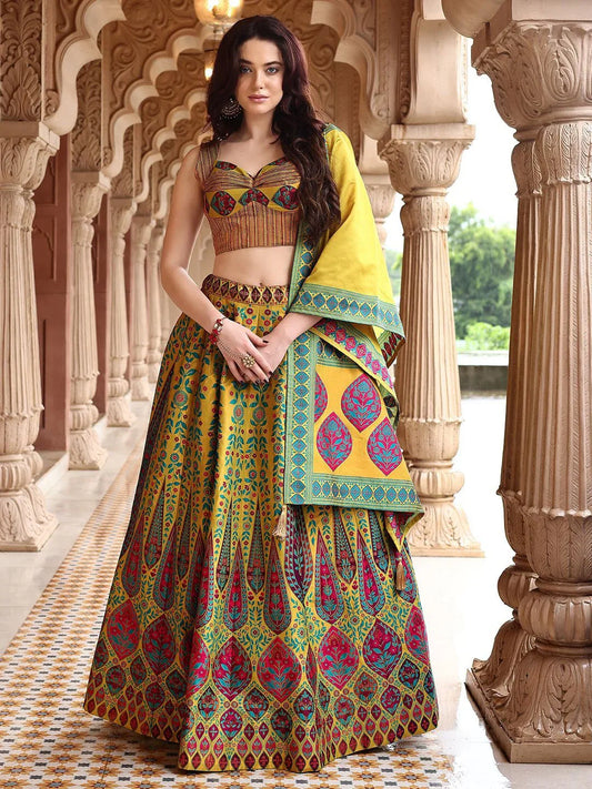 Woman in a colorful traditional outfit standing in an ornate architectural setting Glanzavi