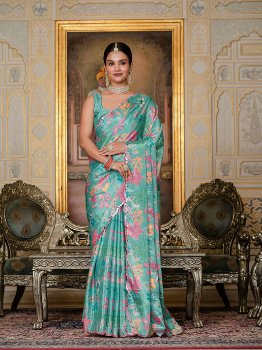Woman in a green floral saree standing in an ornate room with decorative chairs and wall Glanzavi.