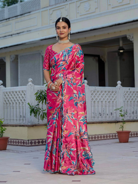 Woman in a pink floral saree standing in front of a traditional building Glanzavi.