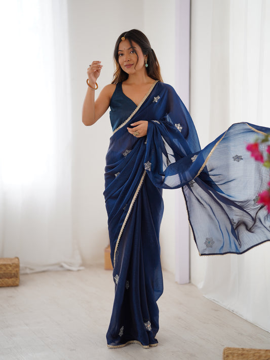 Star Teal Blue Georgette Saree with Silver Floral Embellishments and Gold Border