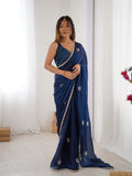 Star Teal Blue Georgette Saree with Silver Floral Embellishments and Gold Border